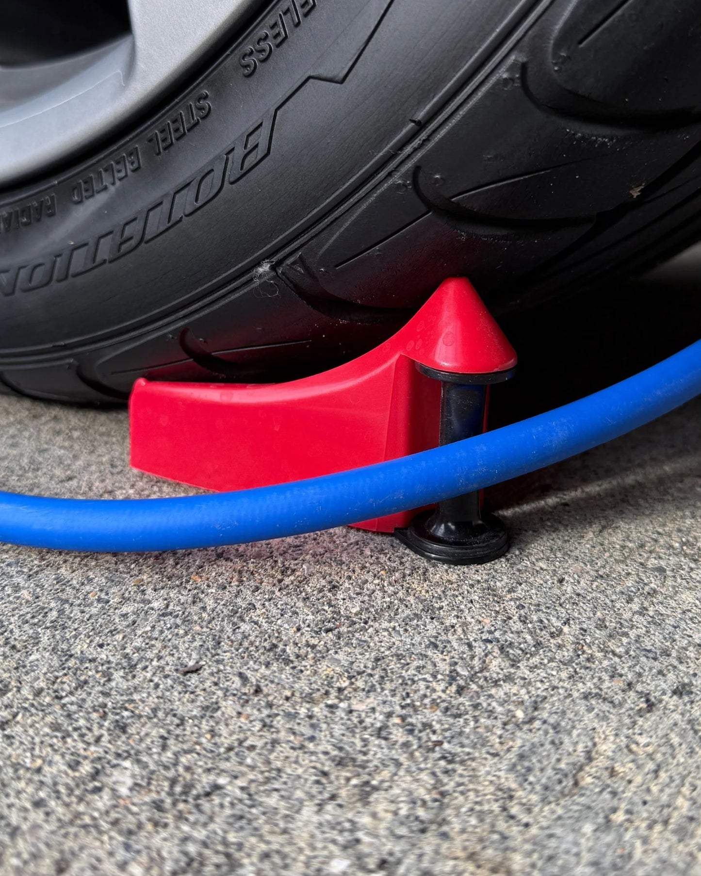 Hose Guide Wheel Wedge Under Tire Blue Hose