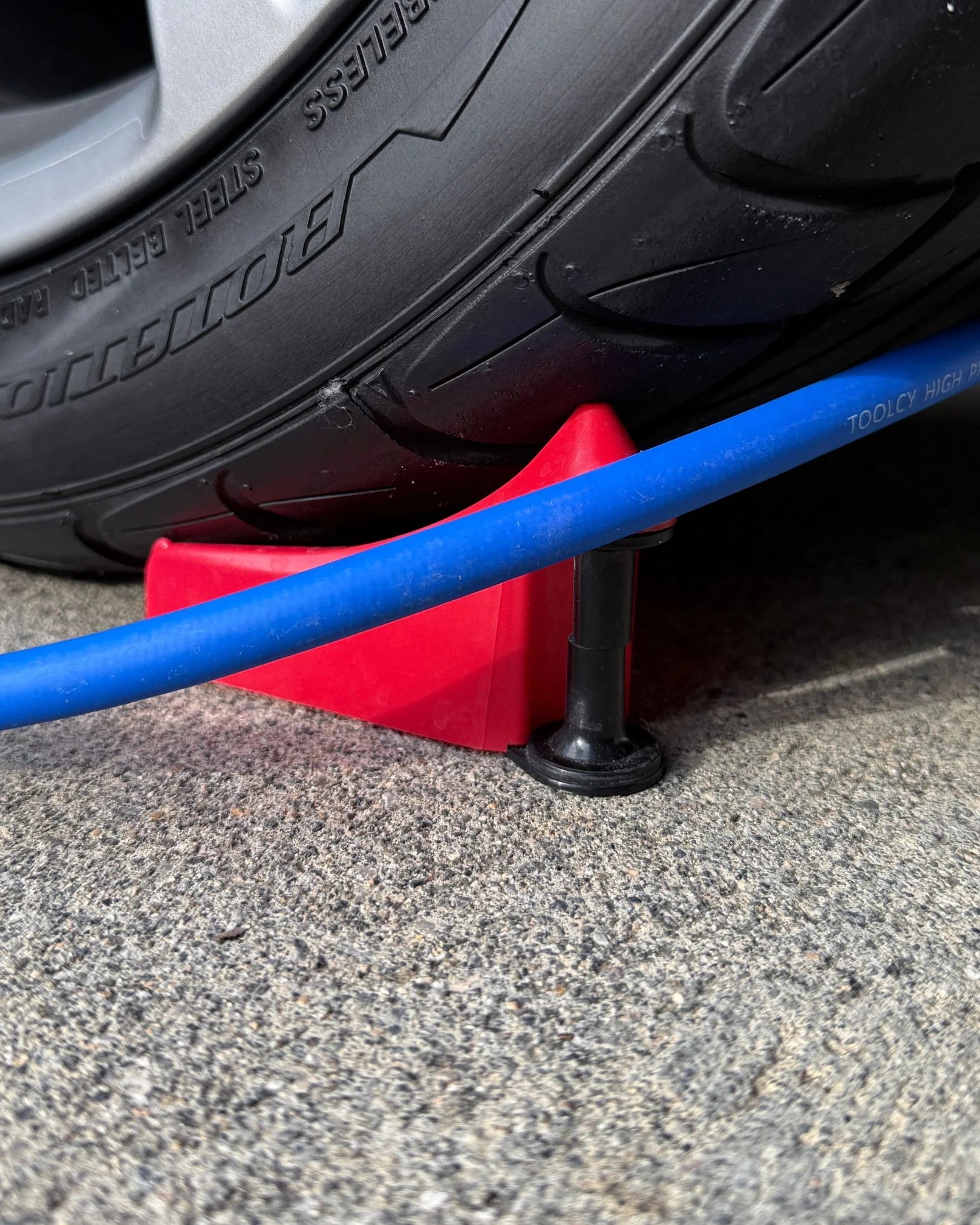 Hose Guide Wheel Wedge Under Tire Blue Hose 2